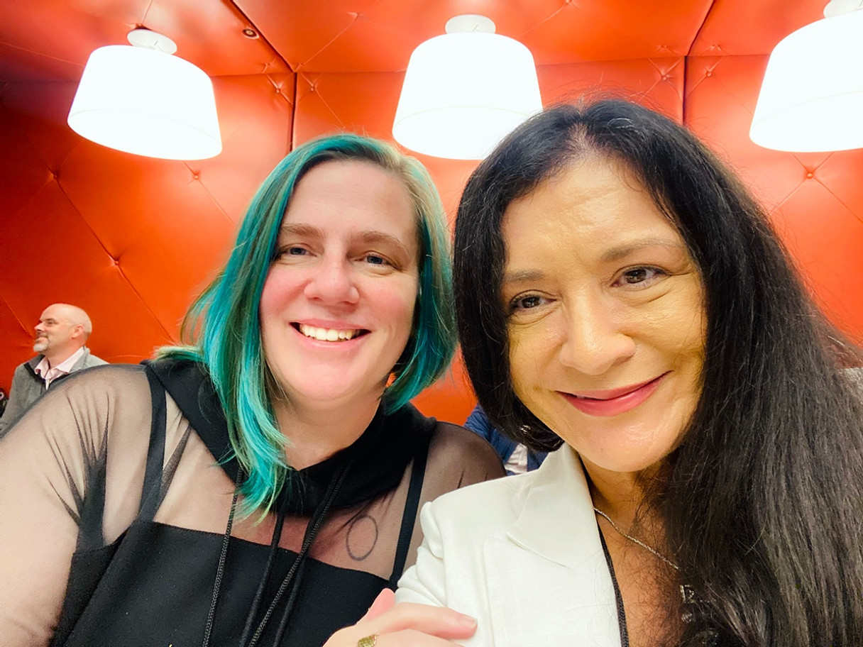 Two woman smiling at the camera