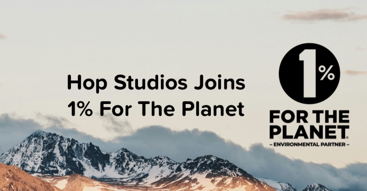 A mountain background with the 1% For the Planet environmental partner logo on the right side with black text reading