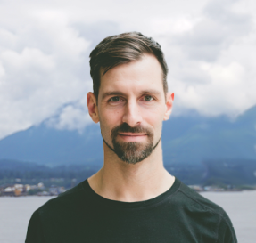 Portrait of Rowan Sentesy with mountains in the background