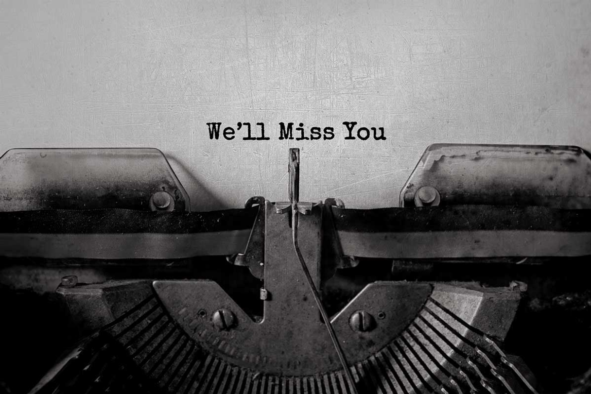 Paper in a typewriter with 'We'll Miss You' typed out